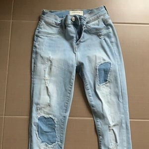 Pacsun light wash ripped jeans with patches. High Rise Jegging size 24.